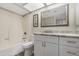 Bathroom with tub-shower and vanity with framed mirror at 2844 W Christy Dr, Phoenix, AZ 85029