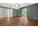 Large bedroom with wood-look flooring, ensuite bath and closet access at 2844 W Christy Dr, Phoenix, AZ 85029