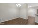 Bright dining area featuring wood floors and modern lighting at 2844 W Christy Dr, Phoenix, AZ 85029