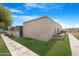 A quaint single-story home with stucco exterior, well-kept lawn and sidewalk pathway at 2844 W Christy Dr, Phoenix, AZ 85029