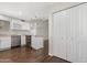Spacious kitchen with white cabinetry, granite countertops, stainless steel appliances, and an island with a cooktop at 2844 W Christy Dr, Phoenix, AZ 85029