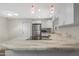 Beautiful kitchen with a large center island, granite countertops, modern appliances, and sleek white cabinetry at 2844 W Christy Dr, Phoenix, AZ 85029
