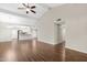 Bright, open-concept living space with hardwood floors, fireplace, and seamless flow to the kitchen, perfect for modern living at 2844 W Christy Dr, Phoenix, AZ 85029