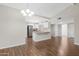 Open floor plan showcasing a modern kitchen with stainless steel appliances connected to the living space at 2844 W Christy Dr, Phoenix, AZ 85029