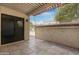 Private, covered patio with tile flooring and metal railing that provides an intimate outdoor space at 2844 W Christy Dr, Phoenix, AZ 85029