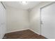 An empty room with light walls and wood floors. Contains a door and closet at 2844 W Christy Dr, Phoenix, AZ 85029