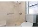 Shower with tile surround, grab bar, and seat at 2844 W Christy Dr, Phoenix, AZ 85029