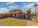 Backyard features a patio, grass, and a fenced pool at 2916 E Amber Ridge Way, Phoenix, AZ 85048