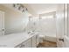 Bright bathroom with a large mirror, single sink vanity, and a shower-tub combo at 2916 E Amber Ridge Way, Phoenix, AZ 85048