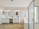 This contemporary bathroom features double sinks, a walk-in shower and a luxurious soaking tub at 2916 E Amber Ridge Way, Phoenix, AZ 85048