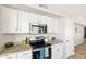 Modern kitchen showcasing granite countertops and stainless steel appliances at 2916 E Amber Ridge Way, Phoenix, AZ 85048