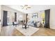 Bright living room with wood floors, vaulted ceiling, and neutral colors at 2916 E Amber Ridge Way, Phoenix, AZ 85048