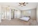 Spacious main bedroom features a modern ceiling fan, a sliding barn door and ensuite access at 2916 E Amber Ridge Way, Phoenix, AZ 85048