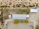 Aerial view of a metal building with mature trees surrounded by fencing at 29204 N Bryce Trl, Queen Creek, AZ 85144