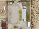 Aerial view of property with metal building, riding arena, and horse training areas at 29204 N Bryce Trl, Queen Creek, AZ 85144