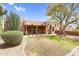 Wide backyard view of the single-story home showing covered patio at 29204 N Bryce Trl, Queen Creek, AZ 85144