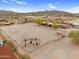 Aerial view of equestrian facilities, highlighting a spacious arena and surrounding landscape perfect for horse training at 29204 N Bryce Trl, Queen Creek, AZ 85144