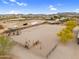 Aerial view of equestrian arena and surrounding community, showcasing ample space for horse riding activities and training at 29204 N Bryce Trl, Queen Creek, AZ 85144
