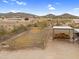 Aerial view of equestrian arena featuring a hay storage area and fencing, ideal for horse owners and enthusiasts at 29204 N Bryce Trl, Queen Creek, AZ 85144