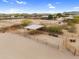 Aerial view of equestrian facilities with covered stalls, offering a well-equipped space for horse care and training at 29204 N Bryce Trl, Queen Creek, AZ 85144