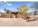 Exterior view of the house with a gated front yard, desert landscaping, and seating at 29204 N Bryce Trl, Queen Creek, AZ 85144