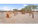 Close-up view of horse corral area with rustic metal fencing, offering safe containment for equestrian activities at 29204 N Bryce Trl, Queen Creek, AZ 85144