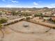 Fenced desert land featuring horse property with metal canopy, views of the surrounding community, and distant mountains at 29204 N Bryce Trl, Queen Creek, AZ 85144