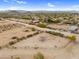 Spacious horse property featuring a metal canopy with desert views and surrounding community at 29204 N Bryce Trl, Queen Creek, AZ 85144