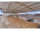 Covered horse stalls with steel beams, wood framing, a dirt floor, and views of the mountains beyond at 29204 N Bryce Trl, Queen Creek, AZ 85144