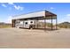 Covered horse trailer parking offers protection from the elements at 29204 N Bryce Trl, Queen Creek, AZ 85144