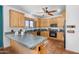 Bright kitchen featuring light wood cabinetry, terracotta tile floors, and tile countertops at 29204 N Bryce Trl, Queen Creek, AZ 85144