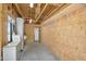 Workshop featuring plywood walls, concrete floors, shelving, a wash basin and access to the barn at 29204 N Bryce Trl, Queen Creek, AZ 85144