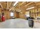 Spacious workshop with plywood walls, concrete floor, windows for natural light, and a ceiling fan at 29204 N Bryce Trl, Queen Creek, AZ 85144