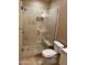 Modern bathroom with glass enclosed shower and tiled walls, plus a toilet and sink nearby at 2929 W Yorkshire Dr # 2118, Phoenix, AZ 85027