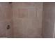 Close-up of a tiled shower with a built-in niche and shower head at 2929 W Yorkshire Dr # 2118, Phoenix, AZ 85027