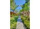 Well-manicured community greenway with lush lawns, mature trees, and colorful flowerbeds at 2929 W Yorkshire Dr # 2118, Phoenix, AZ 85027
