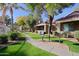 Well-maintained condominium exterior with lush landscaping and walkways at 2929 W Yorkshire Dr # 2118, Phoenix, AZ 85027
