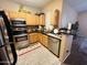Efficient kitchen layout features stainless steel appliances, ample cabinet space, and a convenient breakfast bar for easy dining at 2929 W Yorkshire Dr # 2118, Phoenix, AZ 85027