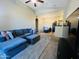 Inviting living room features vaulted ceilings, plush seating, and open layout seamlessly connecting to the dining area at 2929 W Yorkshire Dr # 2118, Phoenix, AZ 85027