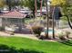 Community pool area with green grass and landscaping, perfect for recreation at 2929 W Yorkshire Dr # 2118, Phoenix, AZ 85027