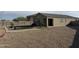 Extensive gravel backyard with desert landscaping, a charming pergola, and a green grass area, creating an inviting outdoor oasis at 29908 W Monterey Dr, Buckeye, AZ 85396