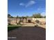 Large backyard with desert landscaping, pergola covered patio, and space for outdoor seating, ideal for relaxation at 29908 W Monterey Dr, Buckeye, AZ 85396