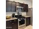 Kitchen featuring stainless steel appliances, granite countertops, and modern finishes at 29908 W Monterey Dr, Buckeye, AZ 85396
