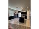 Spacious kitchen with island, stainless steel appliances, and dark wood cabinets at 29908 W Monterey Dr, Buckeye, AZ 85396