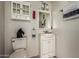 Bathroom with vanity, toilet, and decor for a cozy, functional space at 3137 W Baseline Rd, Laveen, AZ 85339