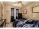 Bedroom featuring neutral walls, ceiling fan, window and comfy bed at 3137 W Baseline Rd, Laveen, AZ 85339
