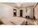 Airy bedroom featuring a large bed, soft carpet, and easy access to other rooms in the house at 3137 W Baseline Rd, Laveen, AZ 85339
