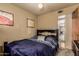 Bedroom featuring neutral walls, ceiling fan, window and comfy bed at 3137 W Baseline Rd, Laveen, AZ 85339