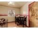 Dining area featuring bright walls, hardwood floors, and a table with chairs at 3137 W Baseline Rd, Laveen, AZ 85339