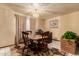 A dining room featuring a chandelier, wood furniture and adjacent dining area at 3137 W Baseline Rd, Laveen, AZ 85339